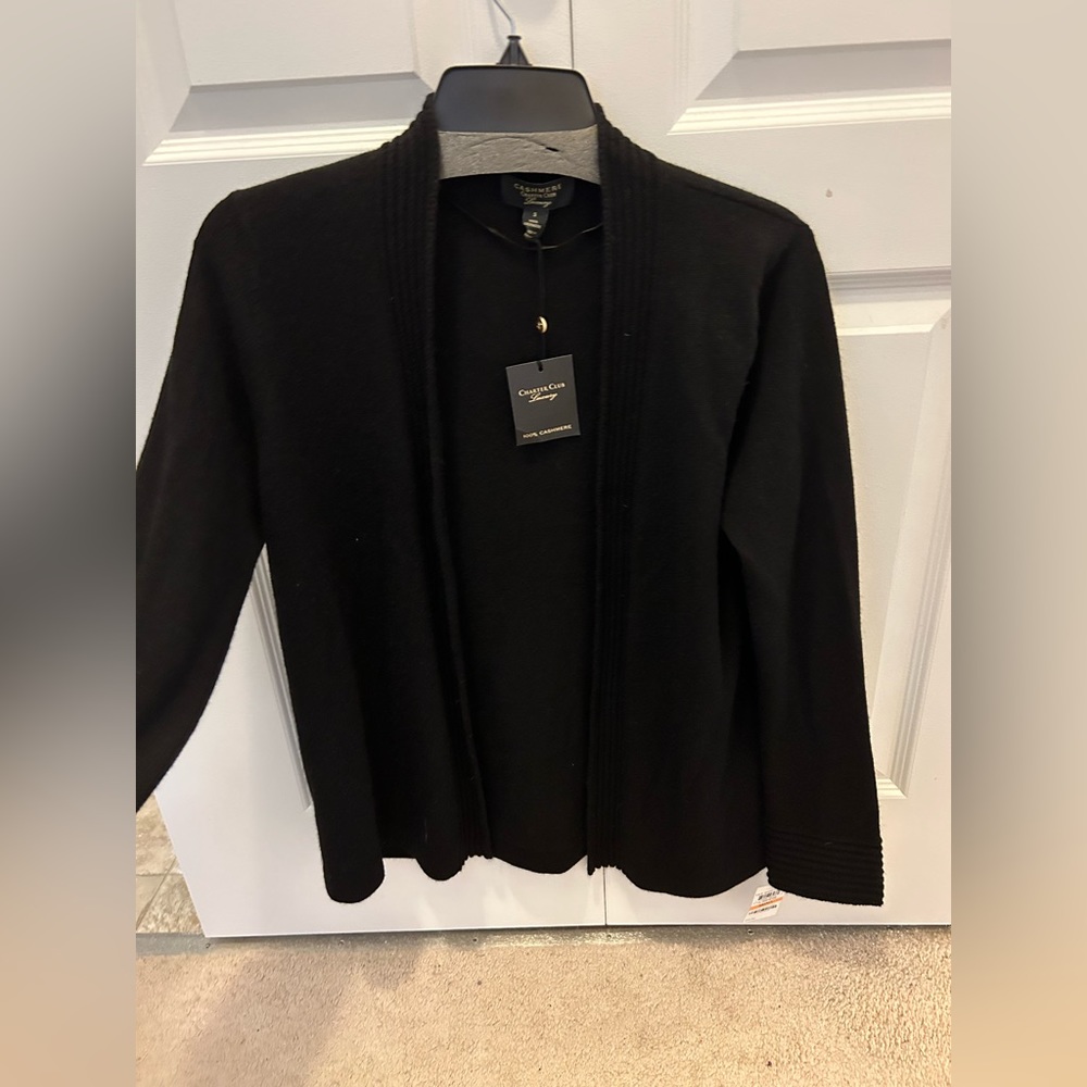 Woman’s black cashmere sweater.
